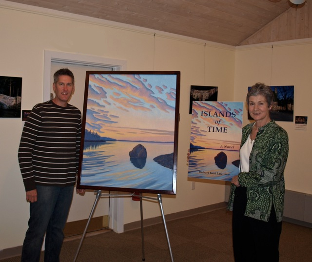 Artist Scott Baltz with his beautiful painting "Dimming Light Passing," that is the basis for the cover of Islands of Time with me in the Northeast Harbor Library for the launch of Islands of Time.